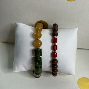Two beaded bracelets with wood and colourful acrylic beads